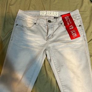LIGHT WASH VIP JEANS with red tag
